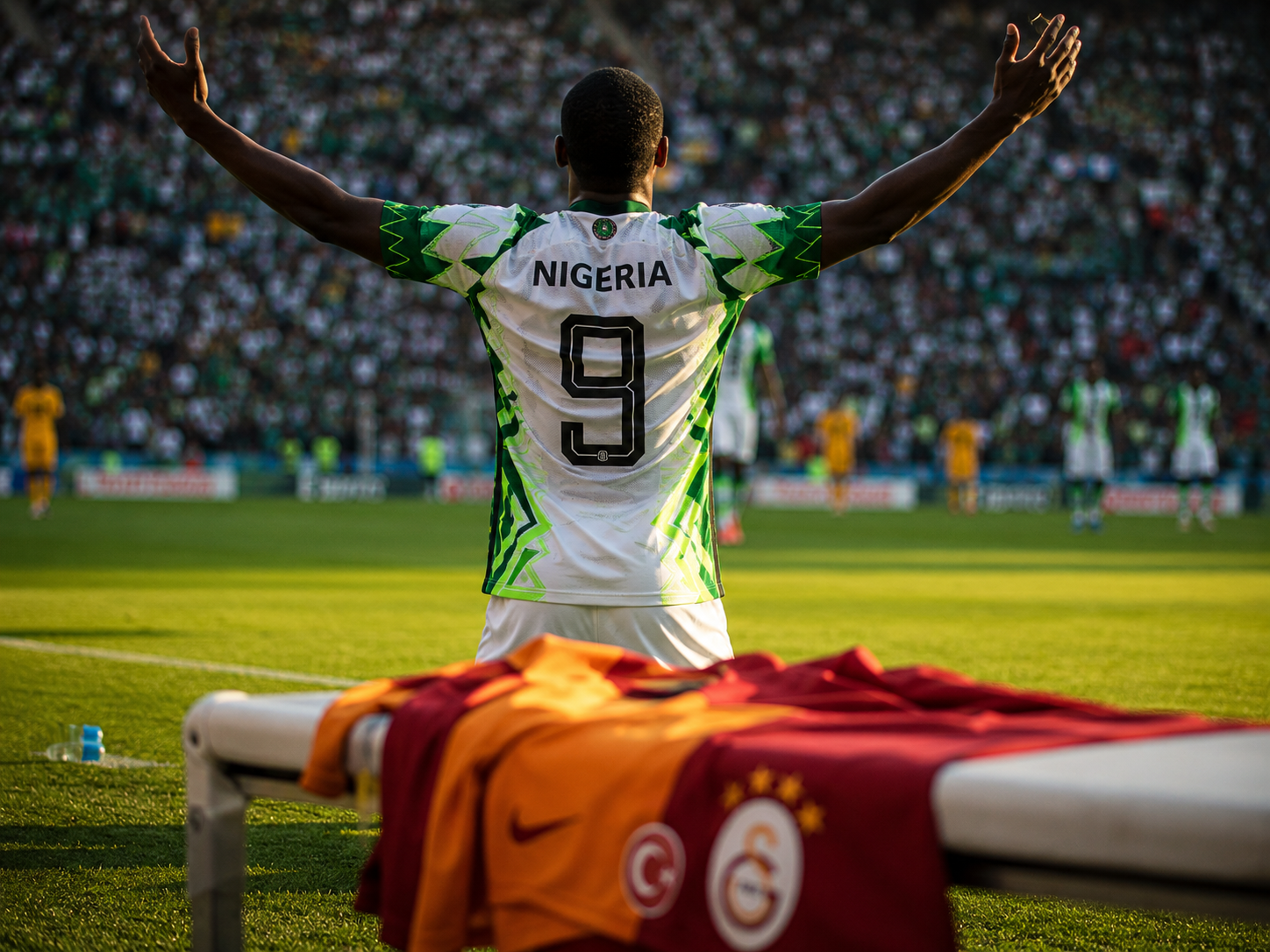 Victor Osimhen celebrating in Nigeria kit with Galatasaray jersey nearby.