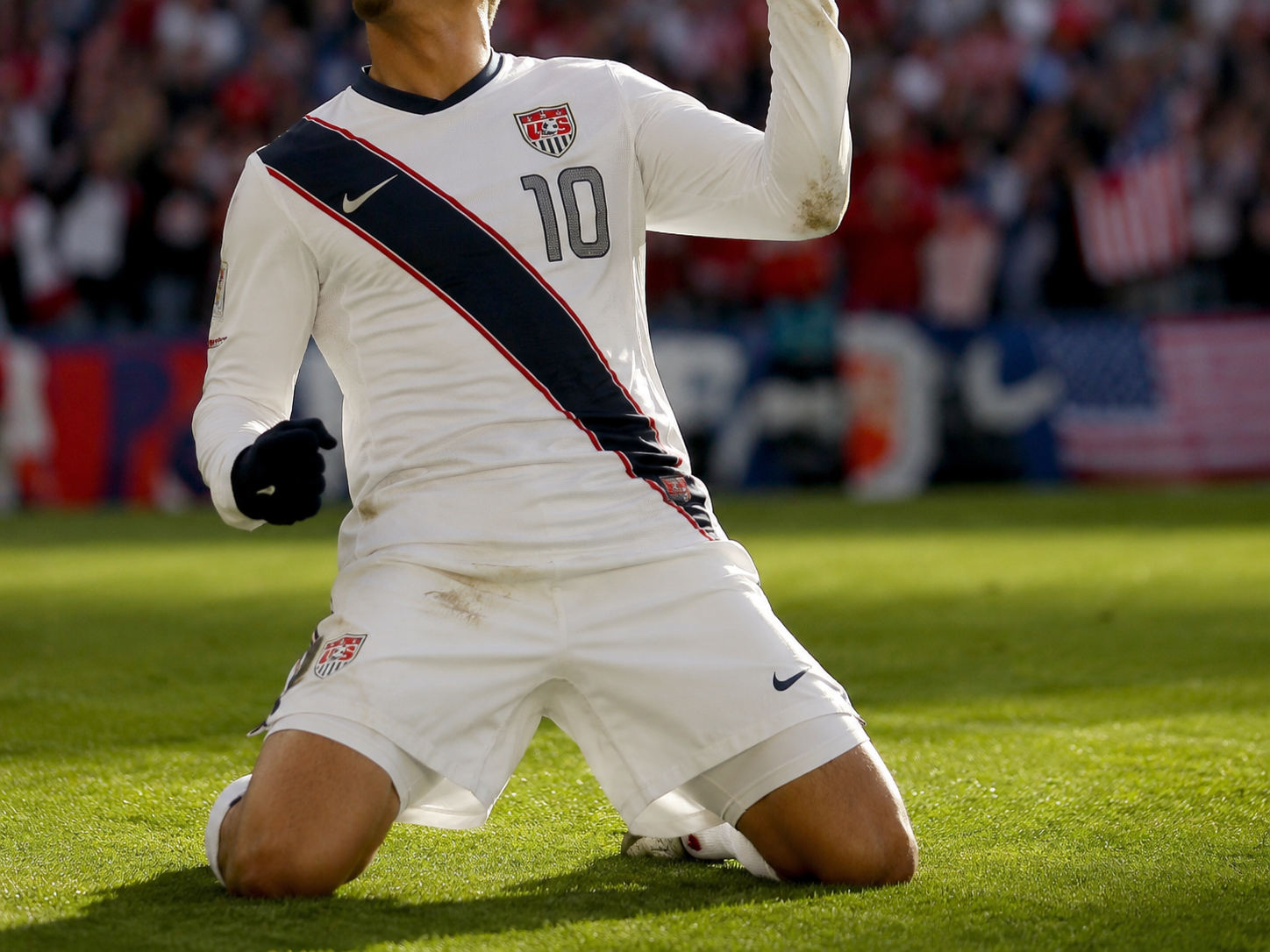 USA soccer player celebrates a last-minute World Cup goal.