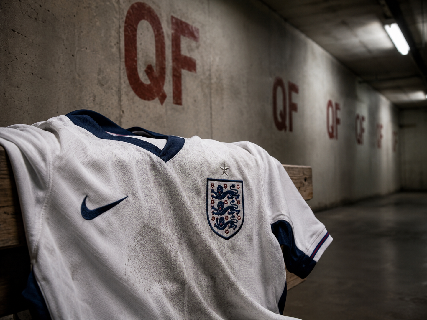 England football shirt abandoned in a stadium tunnel under a quarter-final sign.